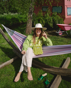 Woman carrying The Mae Bag Green crochet handbag by Dazzled outdoors