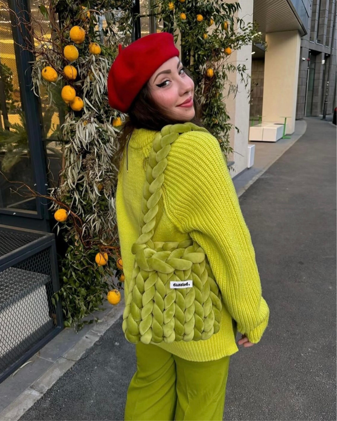 Model wearing The Mae Bag Green crochet handbag by Dazzled
